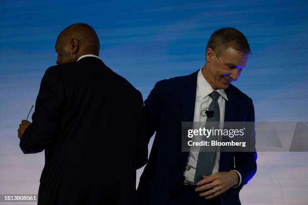 Scott Kirby, chief executive officer of United Airlines Holdings Inc., right, greets Sylvester Turner, mayor of Houston, during a news conference at...