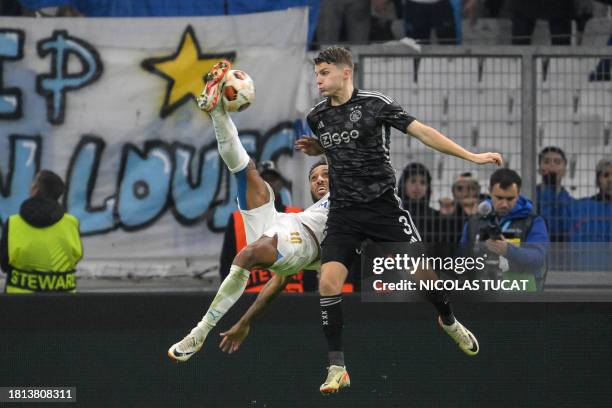 Marseille's French-Gabonese forward Pierre-Emerick Aubameyang scissor kicks the ball and scores a goal during the UEFA Europa League Group B football...