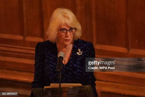Queen Camilla delivers a speech attends the Biennial RIFLES Awards Dinner at the City of London Guildhall on November 30, 2023 in London, England.