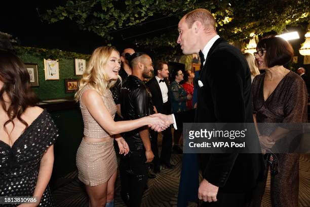 Prince William, Prince of Wales talking to Zara Larsson during the Royal Variety Performance at the Royal Albert Hall on November 30, 2023 in London,...