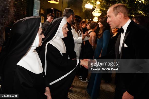 Prince William, Prince of Wales talking to people during the Royal Variety Performance at the Royal Albert Hall on November 30, 2023 in London,...