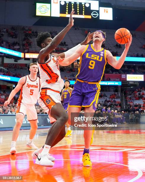 Tigers Forward Will Baker shoots a layup against Syracuse Orange Center Naheem McLeod during the first half of the College Basketball game between...