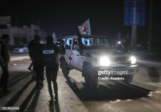 Israeli hostages handed over to Red Cross officials by Palestinian resistance group Hamas in Gaza are taken to Egypt through the Rafah border...