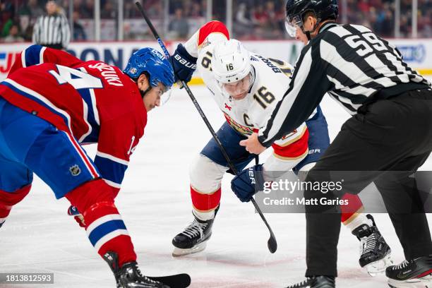 Nick Suzuki of the Montreal Canadiens faces off Aleksander Barkov of the Florida Panthers during the first period of the NHL regular season game...