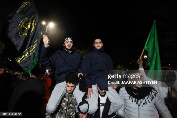 Newly released prisoners are carried by supporters during a welcome ceremony following the release of Palestinian prisoners from Israeli jails in...