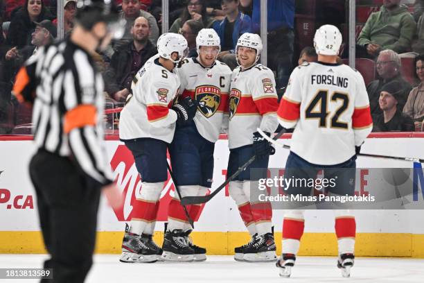 Aleksander Barkov of the Florida Panthers celebrates his goal with teammates Aaron Ekblad, Sam Reinhart and Gustav Forsling during the second period...