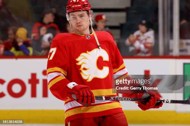 Connor Zary of the Calgary Flames warms up against the Dallas Stars at Scotiabank Saddledome on November 30, 2023 in Calgary, Alberta, Canada.