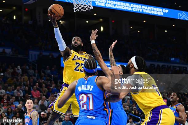 Lebron James of the Los Angeles Lakers goes to the rim during the first half against the Oklahoma City Thunder at Paycom Center on November 30, 2023...