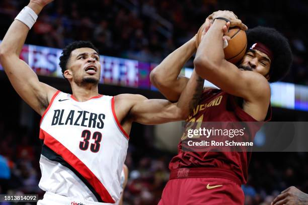 Jarrett Allen of the Cleveland Cavaliers grabs a rebound against Toumani Camara of the Portland Trail Blazers during the second half at Rocket...