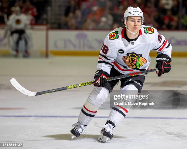 Connor Bedard of the Chicago Blackhawks skates up ice against the Detroit Red Wings during the second period at Little Caesars Arena on November 30,...