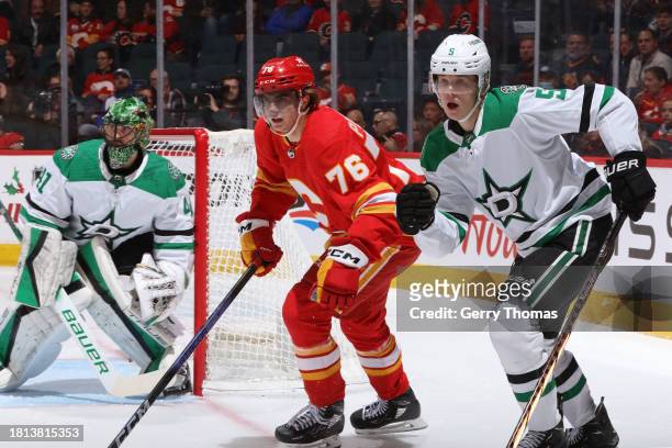 Martin Pospisil of the Calgary Flames skates against Nils Lundkvist of the Dallas Stars in the first period at Scotiabank Saddledome on November 30,...