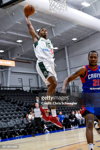 Elijah Hughes of the Wisconsin Herd dunks the ball during the second quarter on November 30, 2023 at Wayne State Fieldhouse in Detroit, Michigan....