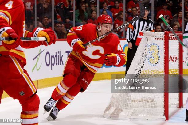 Connor Zary of the Calgary Flames skates against the Dallas Stars at Scotiabank Saddledome on November 30, 2023 in Calgary, Alberta, Canada.