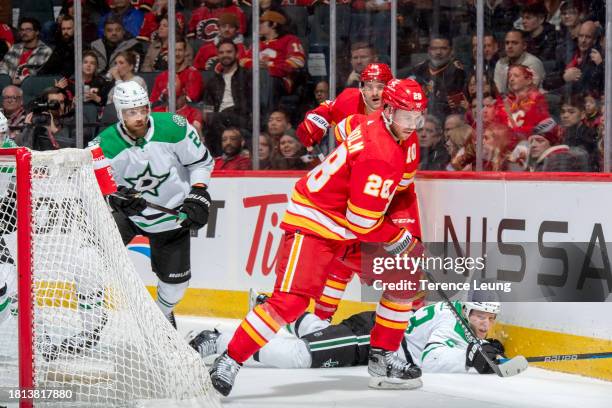 Blake Coleman of the Calgary Flames skates against Esa Lindell of the Dallas Stars at Scotiabank Saddledome on November 30, 2023 in Calgary, Alberta,...