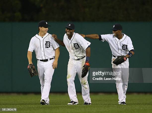 Andy Dirks, Austin Jackson and Torii Hunter of the Detroit Tigers celebrate a win over the Chicago White Sox at Comerica Park on September 20, 2013...