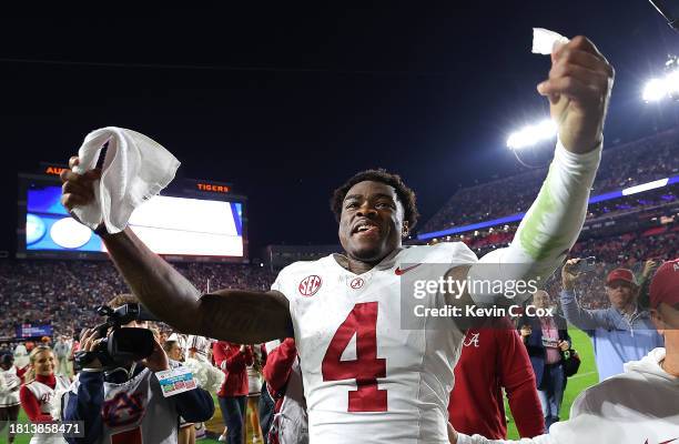 Jalen Milroe of the Alabama Crimson Tide celebrates their 27-24 win over the Auburn Tigers at Jordan-Hare Stadium on November 25, 2023 in Auburn,...