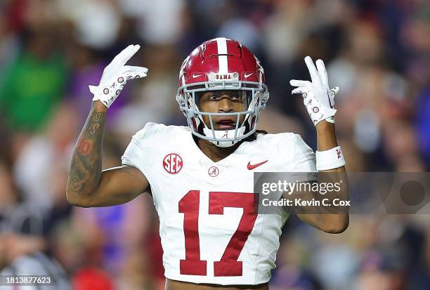 Isaiah Bond of the Alabama Crimson Tide reacts after pulling inthe go-ahead touchdown against the Auburn Tigers during the fourth quarter at...