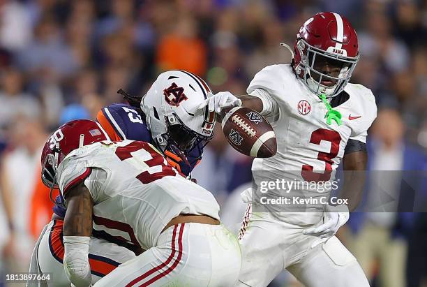 Rivaldo Fairweather of the Auburn Tigers fails to pull in this reception as he is hit by Jihaad Campbell and Terrion Arnold of the Alabama Crimson...