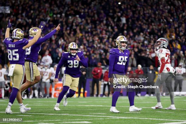 Grady Gross of the Washington Huskies reacts after kicking the winning field goal against the Washington State Cougars in the 115th Apple Cup at...