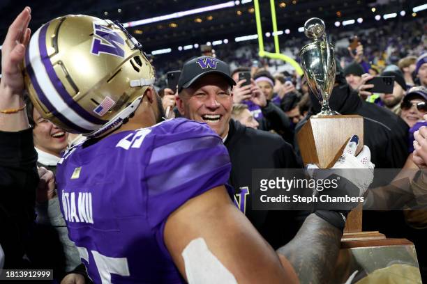 Head coach Kalen DeBoer of the Washington Huskies celebrates the 115th Apple Cup after beating Washington State Cougars 24-21 at Husky Stadium on...
