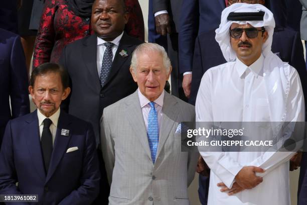 Brunei's Sultan Hassanal Bolkiah, Britain's King Charles III and Qatar's Emir Sheikh Tamim bin Hamad Al-Thani pose with other participating world...