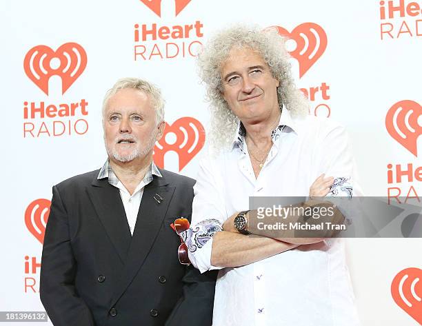 Roger Meddows Taylor and Brian May of Queen arrive at the iHeartRadio Music Festival - press room held at MGM Grand Arena on September 20, 2013 in...