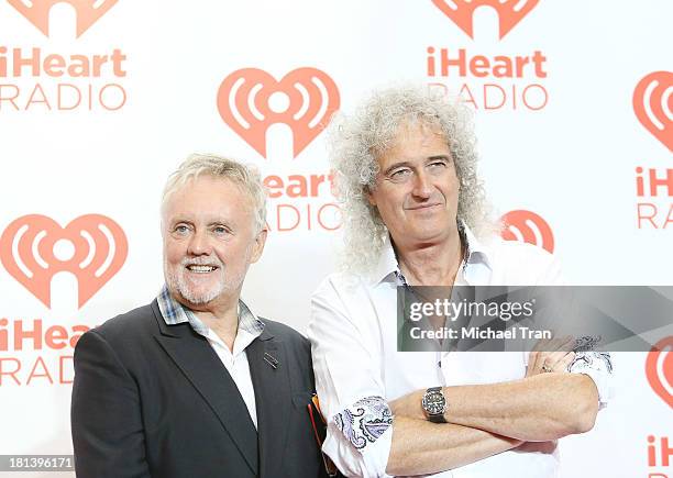 Roger Meddows Taylor and Brian May of Queen arrive at the iHeartRadio Music Festival - press room held at MGM Grand Arena on September 20, 2013 in...