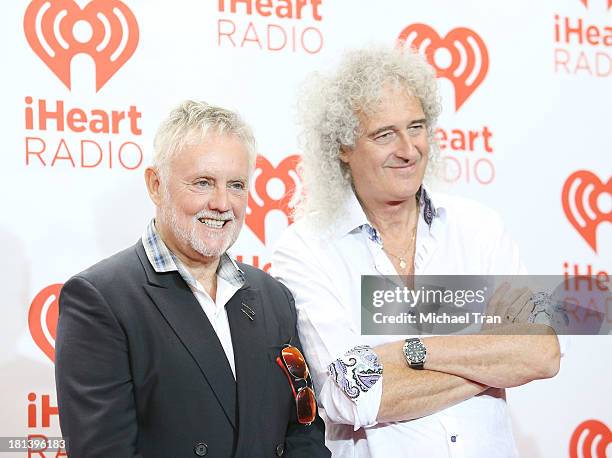 Roger Meddows Taylor and Brian May of Queen arrive at the iHeartRadio Music Festival - press room held at MGM Grand Arena on September 20, 2013 in...