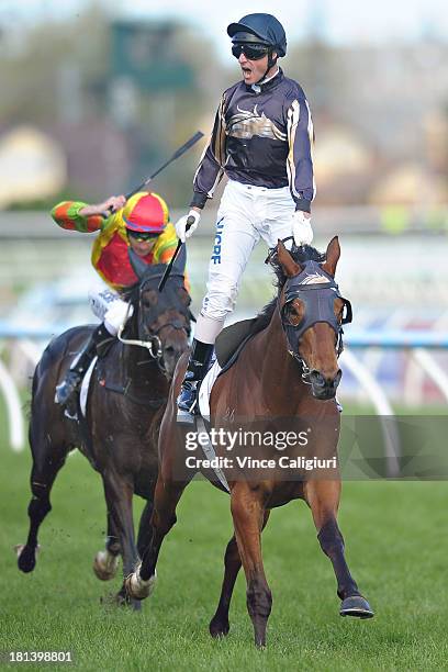 Glen Boss riding Mr O'ceirin celebrates winning the D'Urban Naturalism Stakes during Melbourne Racing at Caulfield Racecourse on September 21, 2013...