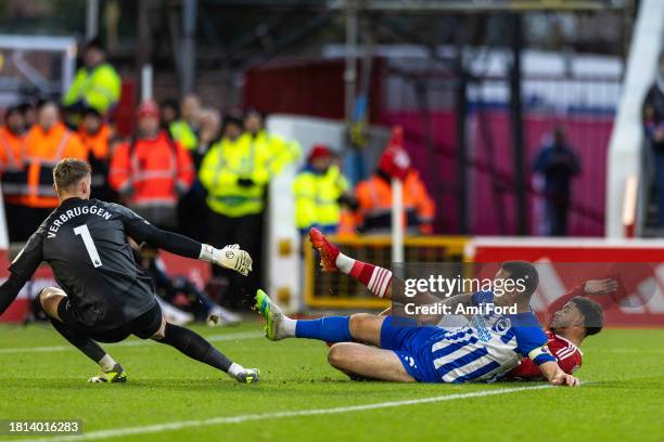 Morgan Gibbs-White of Nottingham Forest is challenged after having a shot on goal by Lewis Dunk of Brighton & Hove Albion during the Premier League...