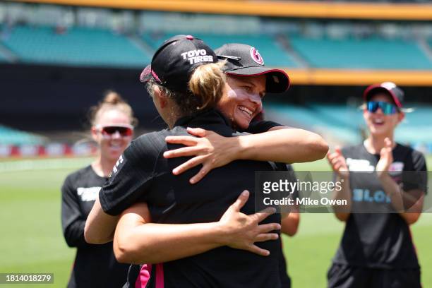 Suzie Bates of the Sixers is presented her 100th WBBL cap prior to the WBBL match between Sydney Sixers and Sydney Thunder at Sydney Cricket Ground,...