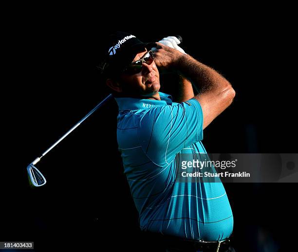 Retief Goosen of South Africa plays a shot during the third round of the Italian Open golf at Circolo Golf Torino on September 21, 2013 in Turin,...