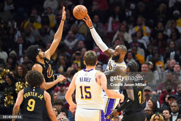 LeBron James of the Los Angeles Lakers passes around Jarrett Allen of the Cleveland Cavaliers during the fourth quarter at Rocket Mortgage Fieldhouse...