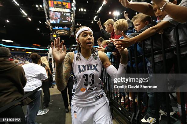 Seimone Augustus of the Minnesota Lynx celebrates with fans after defeating Seattle Storm during the WNBA Western Conference Semifinals Game 1 on...