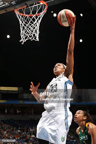 Maya Moore of the Minnesota Lynx goes for the layup against Tina Thompson of the Seattle Storm during the WNBA Western Conference Semifinals Game 1...