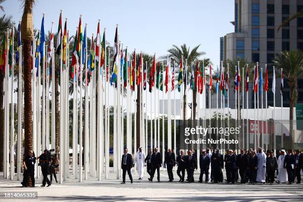 World leaders walk at the Expo City ahead of the United Nations Climate Change Conference COP28 High Level Segment meeting in Dubai, United Arab...