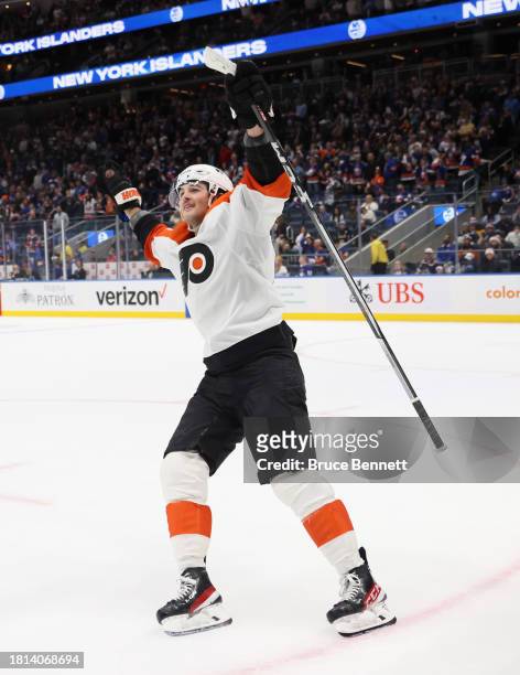Tyson Foerster of the Philadelphia Flyers celebrates his game-winning shootout goal against the New York Islanders at UBS Arena on November 25, 2023...