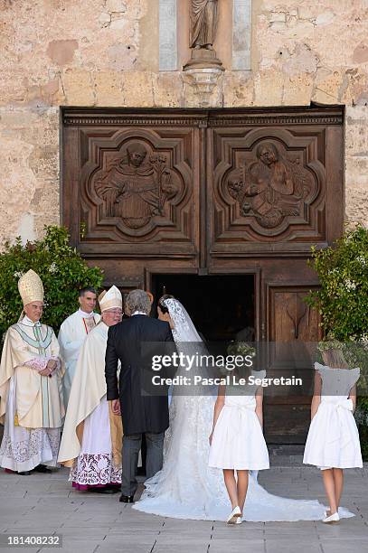 Princess Claire Of Luxembourg and her father Hartmut Lademacher are greeted by Most Reverend Jean-Claude Hollerich, Archbishop of Luxembourg as they...