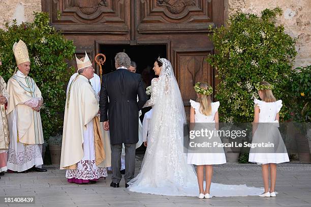 Princess Claire Of Luxembourg and her father Hartmut Lademacher are greeted by Most Reverend Jean-Claude Hollerich, Archbishop of Luxembourg,...