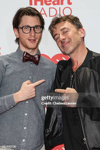 Singer Gary Go and DJ Benny Benassi pose in the iHeartRadio music festival photo room on September 20, 2013 in Las Vegas, Nevada.