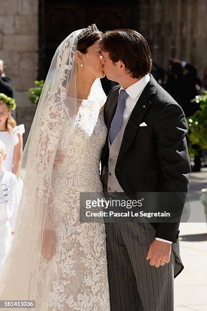 Princess Claire Of Luxembourg and Prince Felix Of Luxembourg kiss as they depart their wedding ceremony at the Basilique Sainte Marie-Madeleine on...
