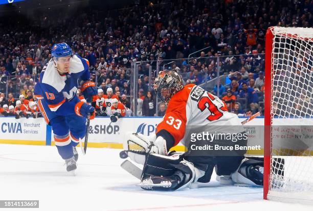 Samuel Ersson of the Philadelphia Flyers makes the shootout save against Mathew Barzal of the New York Islanders at UBS Arena on November 25, 2023 in...