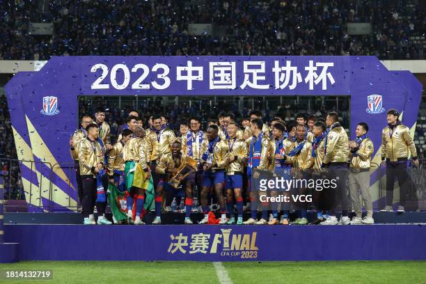 Players of Shanghai Shenhua celebrate with the champion trophy after winning the 2023 Chinese Football Association Cup final match between Shanghai...