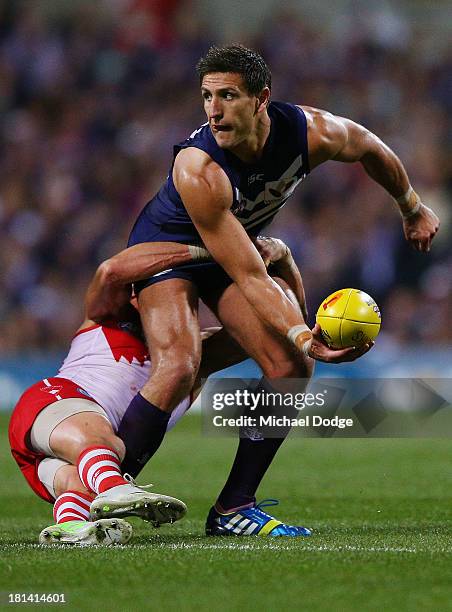 Jude Bolton of the Swans tackles Matthew Pavlich of the Dockers during the AFL Second Preliminary Final match between the Fremantle Dockers and the...