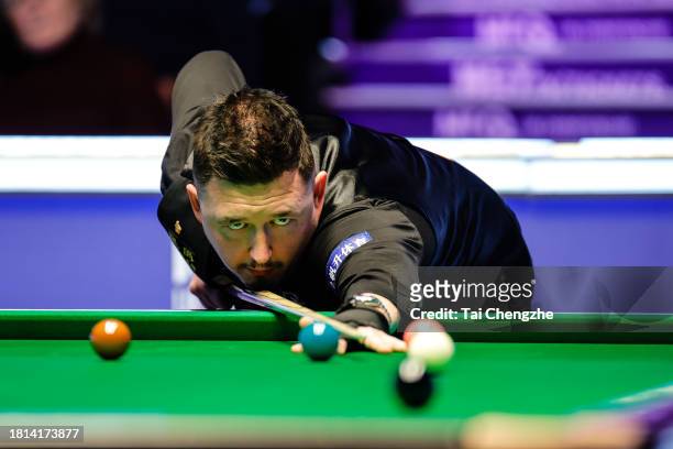 Kyren Wilson of England plays a shot in the second round match against Jamie Clarke of Wales on day 1 of the 2023 MrQ UK Championship at Barbican...