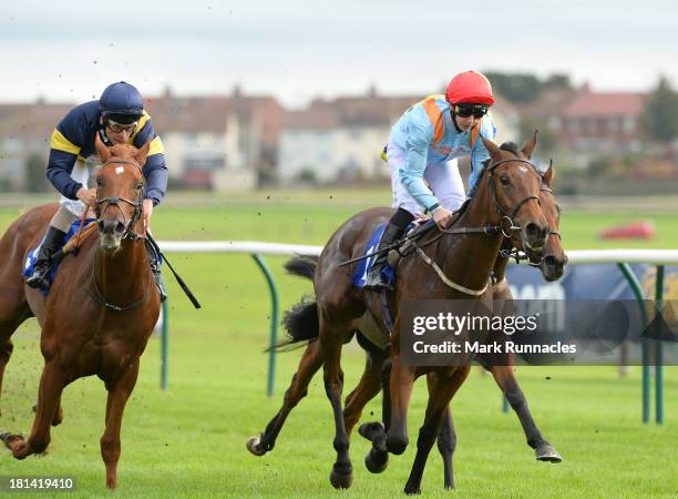 Patrick Mathers riding Latenightrequest winner of The Sked Construction Concrete's What We Do Nursery Handicap Stakes at Ayr racecourse on September...
