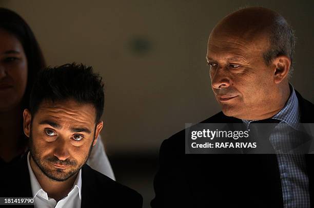 Spanish director Juan Antonio Bayona poses next to Spanish Education and Culture minister Jose Ignacio Wert before receiving the National Prize of...