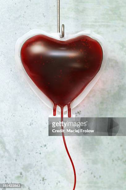 blood bag in shape of a heart - bloody heart stock illustrations