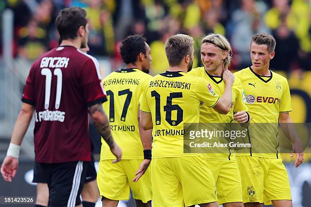 Marcel Schmelzer of Dortmund celebrates his team's first goal with team mates Pierre-Emerick Aubameyang, Jakub Blaszczykowski and Erik Durm during...