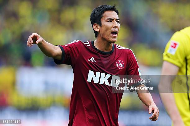 Makoto Hasebe of Nuernberg reacts during the Bundesliga match between 1. FC Nuernberg and Borussia Dortmund at Grundig Stadium on September 21, 2013...